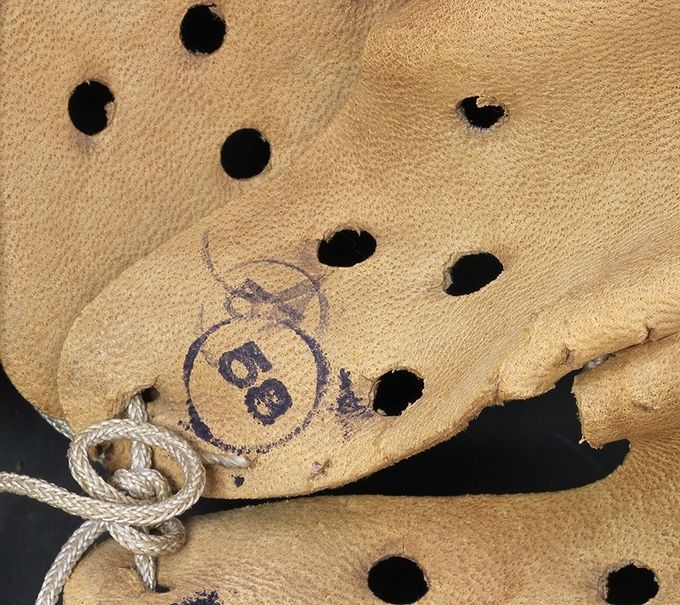 The majority of  leather liners were made of goat skin/sheep skin and to a lesser degree in pigskin. The goat skin leather shown in this picture was soft and comfortable for the wearer. Notice the ink size markings; 57 was stamped error requiring a re-stamp of 58.