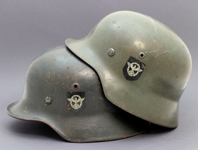 Two M35 ET Polizei helmets with smooth paint. Notice the difference in colors.