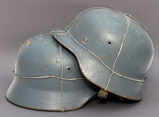 Two medium blue M40 Quist 64 LW helmets with single bailing wire. Both were found together in Norway (Lars Aasen collection).